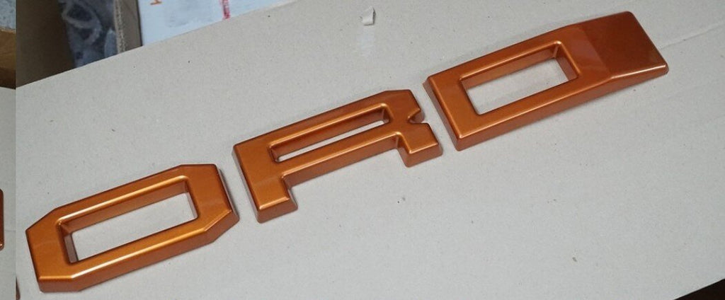 FORD RANGER 

GRILL LETTERS

   'F-O-R-D'

ORANGE LETTERS